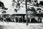 Crowd under an awning, c. 1919