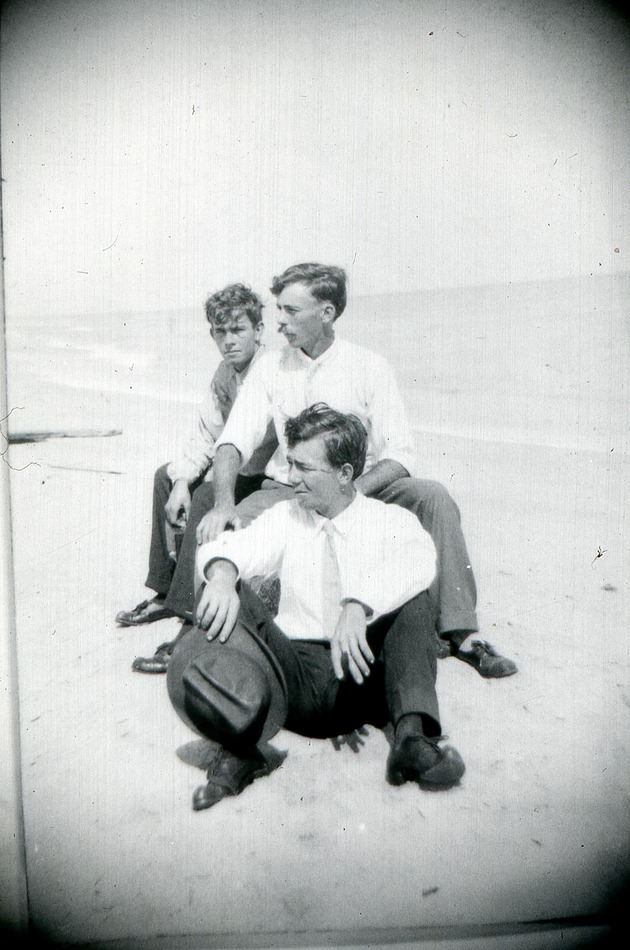 Three men at Manalapan beach, c. 1925