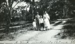 Family on dirt road, 1921