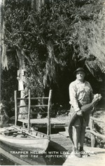 Trapper Nelson with live alligator, Jupiter Florida, c. 1960