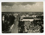 [1930] Aerial View of a Street Scene in Miami Showing Residences, Commercial Buildings, Traffic and Trolleys Running
