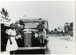 Polly Mays With Children on Front of School Bus,