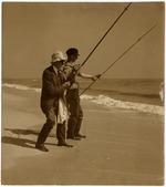 [1940] Two Men Surf Fishing on the Beach