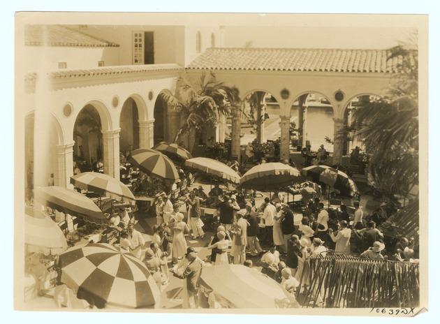 People Dancing and Eating in Courtyard