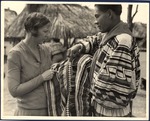 Cory Osceola and a White Woman Examine Seminole Patchwork