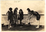 [1921-03-21] Five Girls Observe a Blue Crab on a Miami Beach Dock