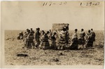 Seminoles Circling Campfire at Forward to the Soil Ceremony