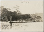 Seminole Indians in a Dugout Canoe