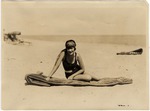 Woman Seated on Beach Mattress
