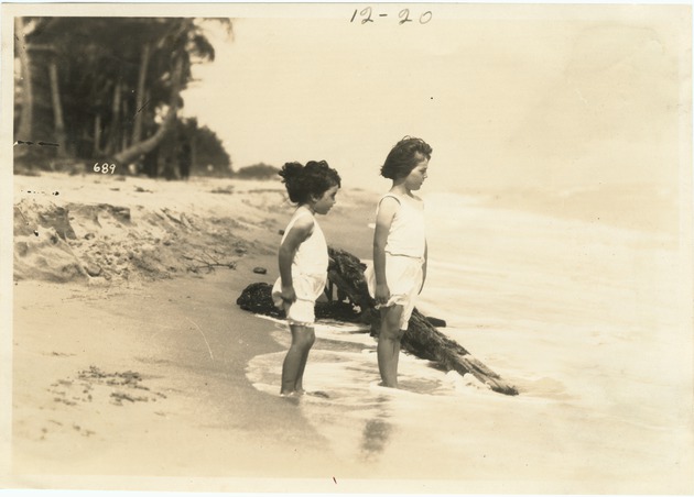 Two Girls Standing in the Surf