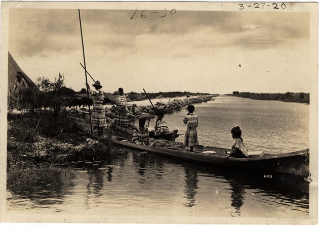 Seminole Indians in a Dugout Canoe