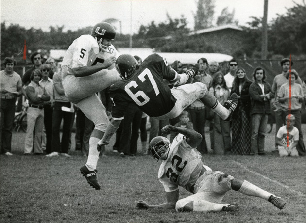 Rod Huffman #5 gets kick safely away