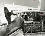 Santa Claus helping load Pan Am jet to Vietnam.