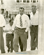 [1951] Jimmy Sullivan ascending steps across the street from the Royal Castle.