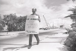 [1979-10] Lone picketer at Port entrance, Art Deco booklet