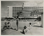 [1963] Guests enjoying the Hotel San Juan pool area.