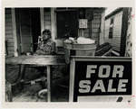 [1979-06-05] Jesse Willingham sitting in chair on the porch of her shotgun house