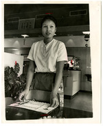 [1964-12-23] Woman setting table