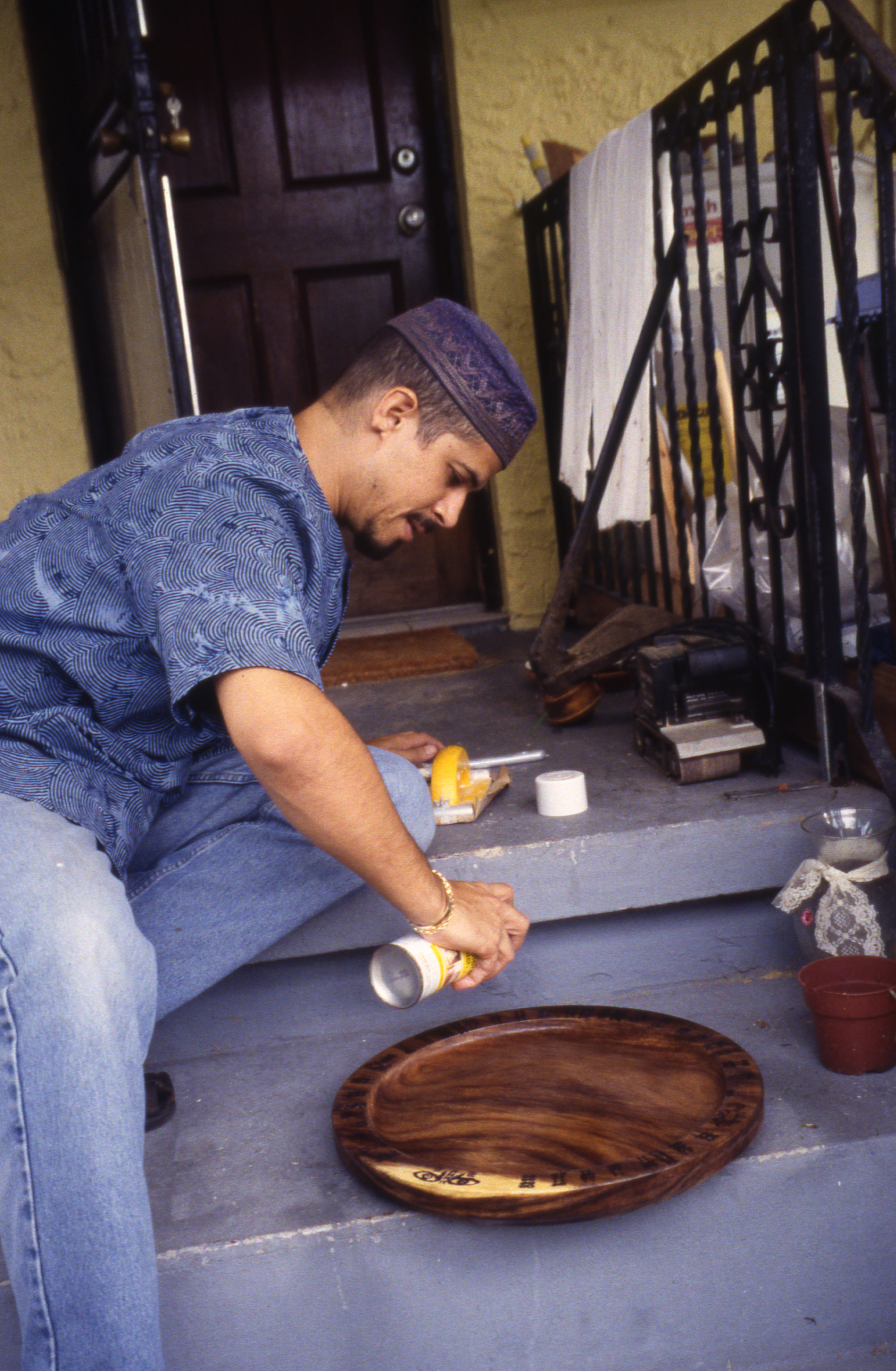 Adrian Castro making an opón Ifá, or divination tray
