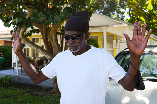 Nate Donaldson, resident of West Grove, poses in front of his shot gun home on Frow Avenue