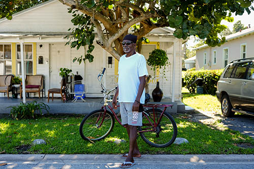 [2022-11-28] Nate Donaldson, resident of West Grove, poses in front of his shot gun home on Frow Avenue