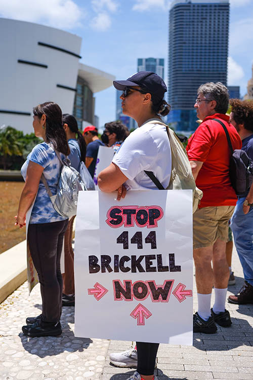 [2023-05-14] Woman with the sign Stop 444 Brickell Now