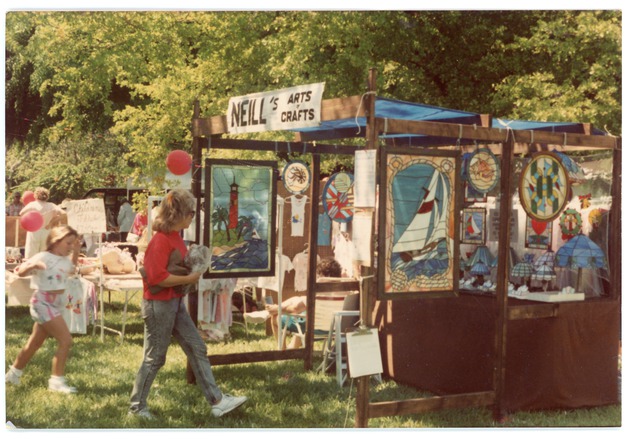 Neill's Arts and Crafts booth at a Semi-Annual Sale Event in Arch Creek park