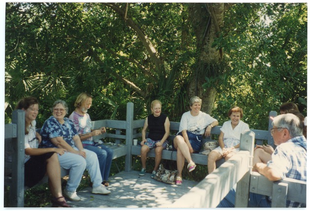 Arch Creek Trust event attendees sitting at the museum porch