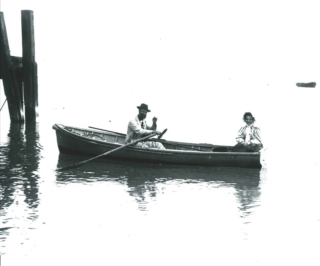 Two unidentified persons in rowboat