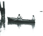 Two unidentified persons in rowboat