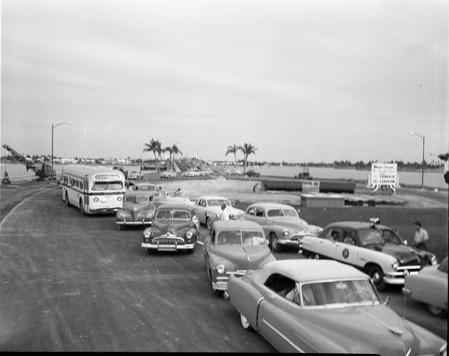Cars drive across the newly opened Broad Causeway Bridge