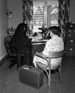 Nun interviews a patient at Villa Maria Nursing Center