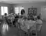 Nun prays with residents before meal at Villa Maria