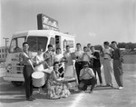 [1958-04-08] Members of North Miami High School band eat pizza at Marcella's Restaurant Food Truck
