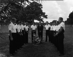 Firefighters lay a wreath at the grave of former fire chief Herbert F. Goyer