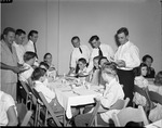 [1951-11-24] Firemen serving meals to children