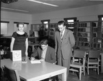 [1958-03-04] Mayor Sasso signing a National Library Week Proclamation at the North Miami Public Library