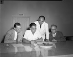 [1951-07-19] City Hall employees review municipal documents