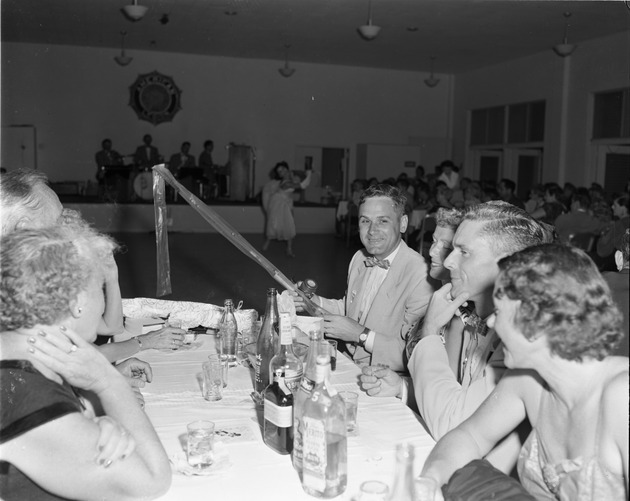 Mayor Joe Ludick opening presents at his birthday party