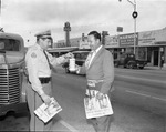 [1957-12-09] Jaycees member collecting money for Variety Children's Hospital