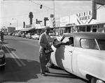 [1957-12-09] Jaycees member, Thomas Sasso, collecting money Street for Variety Children's Hospital