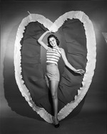 [1959-06-08] Young lady emerging from a heart