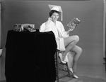 [1959-06-08] Young lady wearing graduation cap and gown