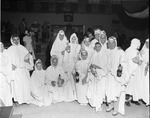 [1954-11-01] Group of people wearing ghost costumes at the Kiwanis Halloween party