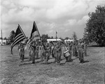 Boy Scouts troop stands in formation waiting to participate in street parade
