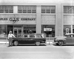 [1954-04-19] Political campaign car for Fuller Warren for Governor parked outside of Peoples Gas Company