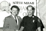 Officer Kenneth Bethel receives Police Officer of the Month Award from the North Miami Chamber of Commerce