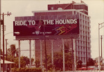 Ride to the Hounds Biscayne Dog Track billboard sign with building in the background