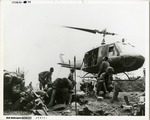 U.S. Army UH-1B Helicopter Resupplying Infantry Position