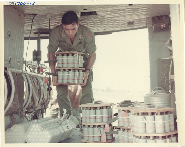 Loading Big Red 1 Alpha (BR1A) Canisters into a UH-1D Helicopter - 